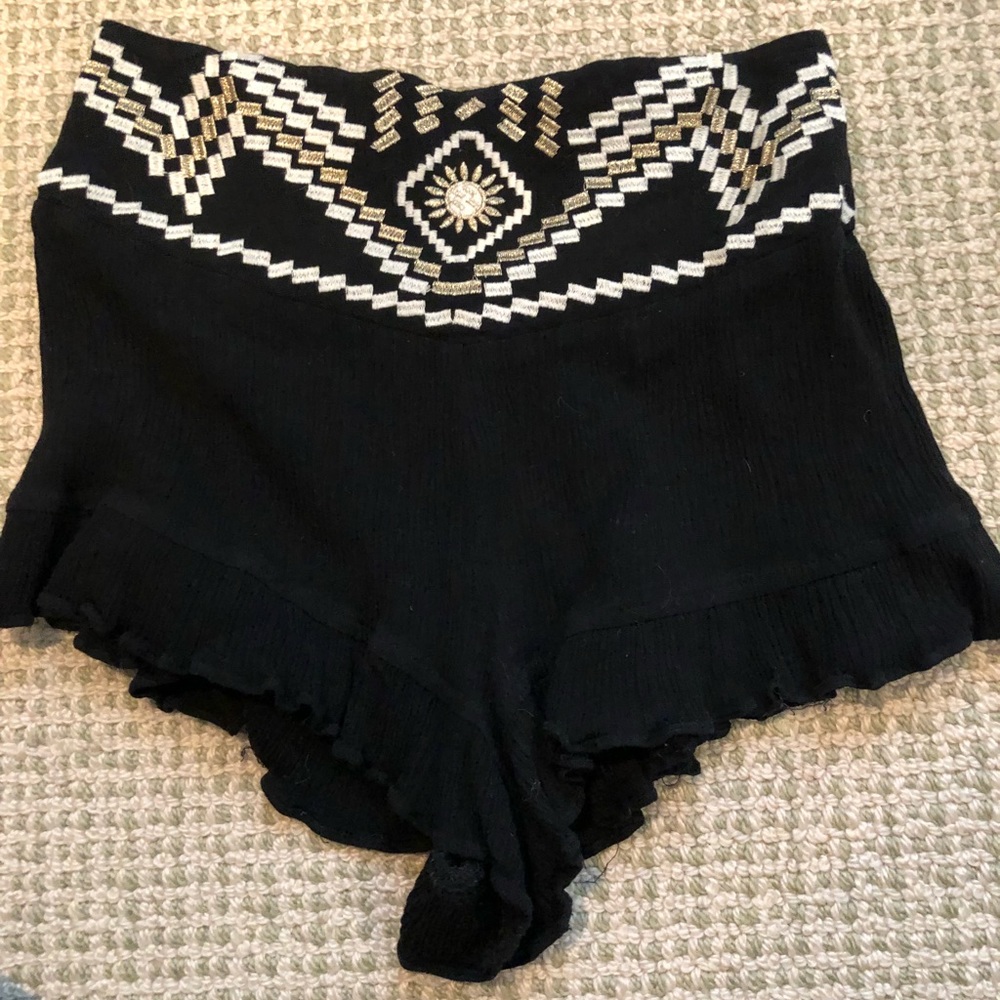 Black flowy shorts with designs